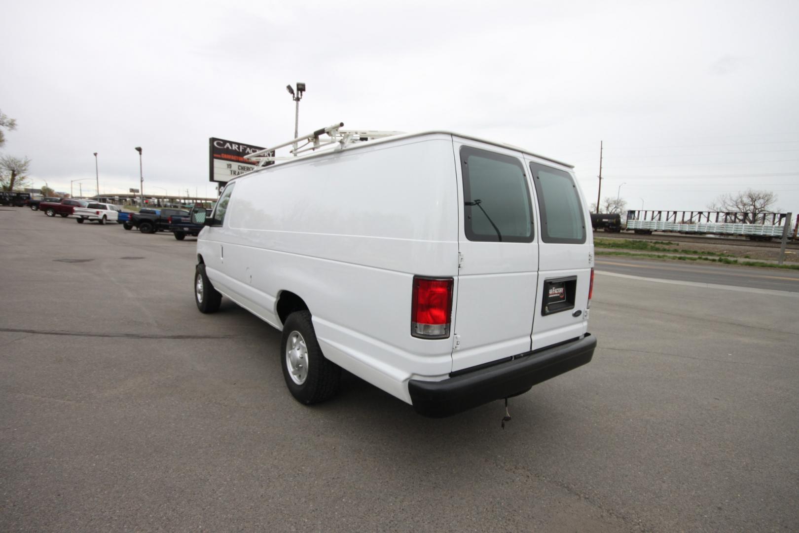 2014 White /Grey Ford E-Series Van (1FTSS3EL3ED) with an 5.4L V8 engine, Automatic transmission, located at 4562 State Avenue, Billings, MT, 59101, (406) 896-9833, 45.769516, -108.526772 - 2014 Ford E-350 Super Duty Extended Cargo Van - One owner - 62,000 miles! 5.4L V8 SOHC 16V FFV Engine - 4 speed automatic transmission - rear wheel drive - 62,752 miles - One owner - Inspected and serviced - Ready to go to work today! Air conditioning - tilt steering wheel - AM/FM audio - powe - Photo#2